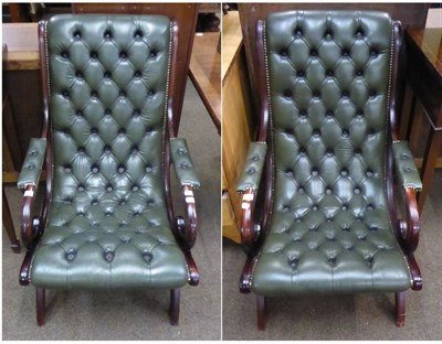 Lot 726 - A pair of reproduction mahogany framed, green leather buttoned armchairs