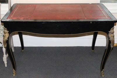 Lot 736 - An ebonised French leather inset bureau plat