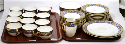 Lot 28 - A Shelley late Foley part set of cups, saucers and dishes, gilt border with blue birds (two trays)
