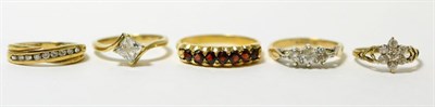 Lot 62 - A 9ct gold garnet ring, finger size T1/2 and four other 9ct gold gem set rings (5)