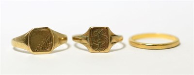 Lot 71 - A 22ct gold band ring and two 9ct gold signet rings (3)