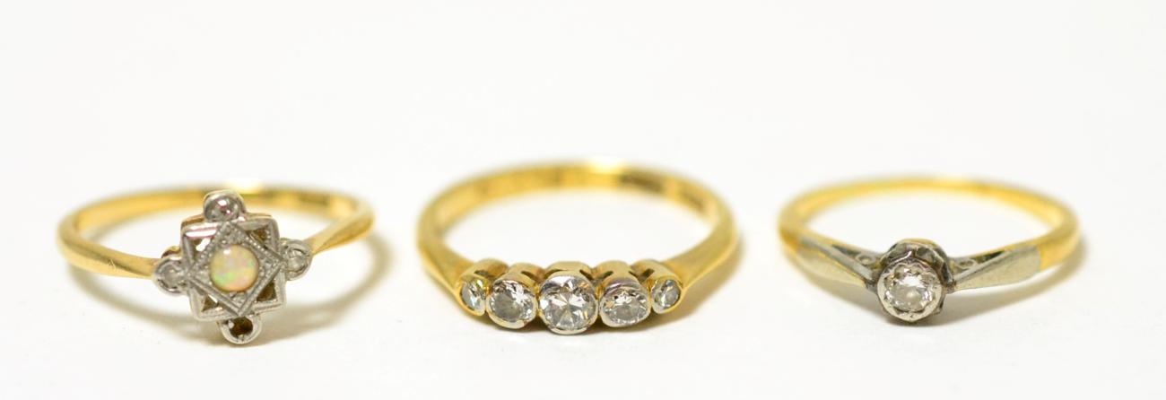 Lot 84 - A five stone diamond ring, a solitaire diamond ring and an opal and diamond ring (one diamond...