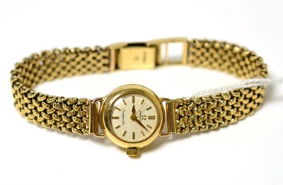Lot 87 - A Lady's 9ct gold Omega watch, on a later 9 carat gold bracelet strap