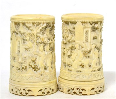 Lot 104 - A pair of late 19th century Chinese pierced ivory twist vases