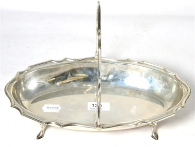 Lot 120 - A silver dish with swing handle by H E Ltd, Sheffield 1911, raised on stepped feet
