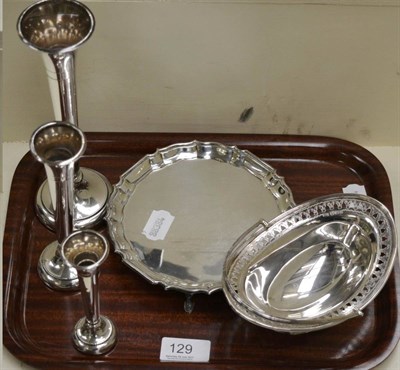 Lot 129 - A silver waiter, bowl and three bud vases