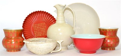 Lot 135 - A group of Oriental items including a cream crackle glaze cup; an iron red dish on pedestal...
