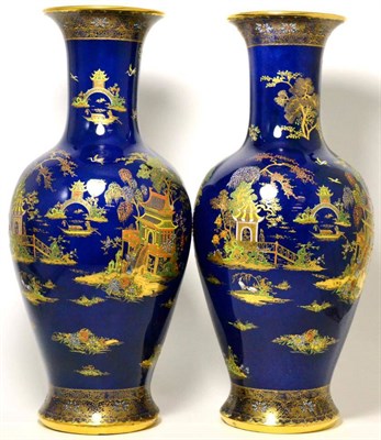 Lot 139 - A pair of Carlton ware blue ground vases in the pagoda pattern