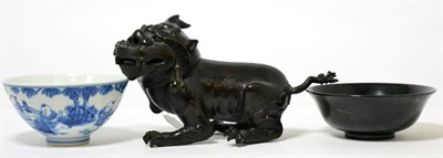 Lot 152 - A group of Oriental items including; a bronze censer in the form of a Foo Dog; a spinach jade bowl