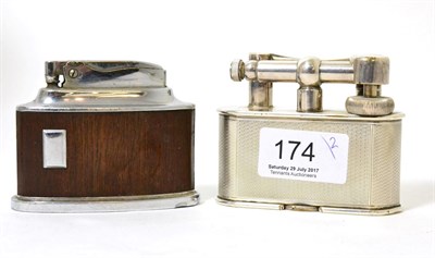 Lot 174 - A Dunhill desk lighter, with engine turned decoration; and a Ronson example