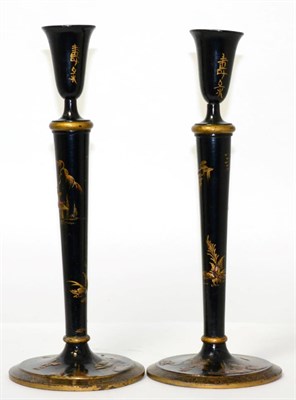 Lot 200 - A pair of wooden oriental candlesticks