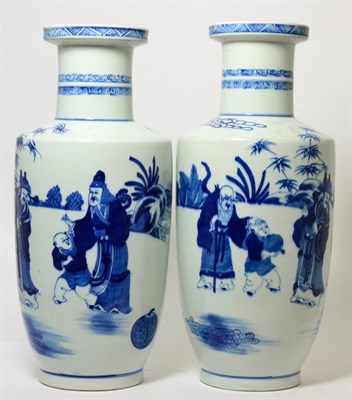Lot 203 - A near pair of Chinese blue and white porcelain rouleau vases
