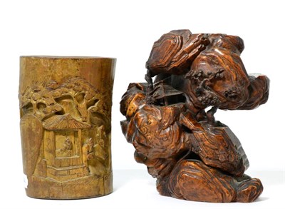 Lot 204 - A Chinese root carving depicting a building in a mountainside; and a carved bamboo brush pot