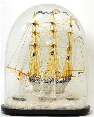 Lot 208 - A Victorian glass frigger model of a ship under glass dome on ebonised plinth base