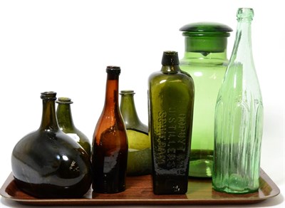 Lot 212 - Six 18th/19th century glass bottles and a green jar and cover (a.f.)