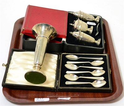 Lot 217 - A cased silver condiment set; two cased set of silver teaspoons; and a silver posy vase