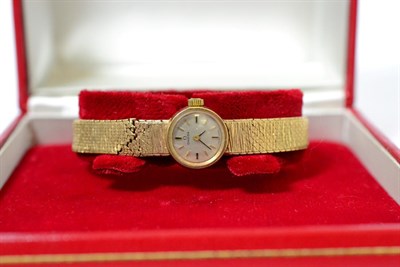 Lot 256 - A 9ct gold lady's wristwatch signed Omega, with Omega box