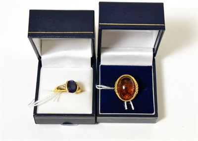 Lot 260 - An 18ct gold iolite and diamond ring together with a 9ct gold amber set ring