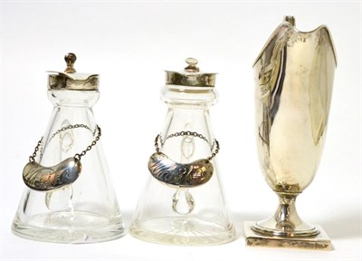 Lot 268 - A pair of silver mounted whisky tots and a silver cream jug