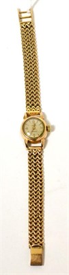 Lot 273 - A lady's Omega wristwatch, on a strap stamped '750'