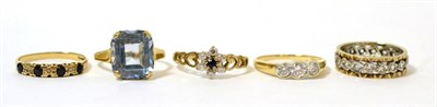 Lot 277 - A 9 carat gold blue topaz ring, finger size J1/2 and four other 9 carat gold gem set rings (5)