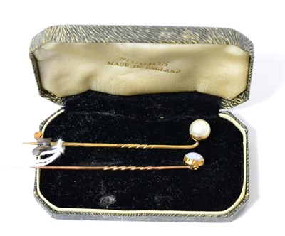 Lot 285 - An opal stick pin and a pearl stick pin, unmarked yellow metal