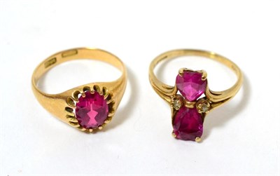 Lot 290 - A red stone set ring stamped 15ct together with a similar two stone example stamped 10K (2)