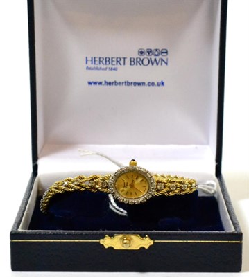 Lot 307 - French yellow gold and clear stone watch, case stamped 14k