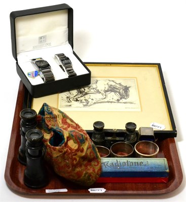 Lot 330 - A group of mixed items to include binoculars, two etchings by Henry Rayner, three silver napkin...