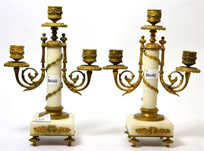 Lot 340 - A pair of marble and gilt metal three light candelabra