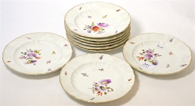 Lot 341 - A group of 19th century hand painted side plates decorated with flowers, with underglaze blue cross