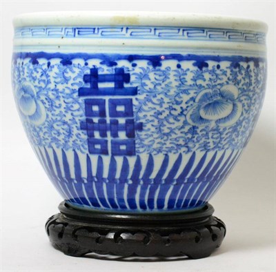 Lot 343 - An early 20th century blue and white Chinese jardiniere with partial import seal and hardwood stand