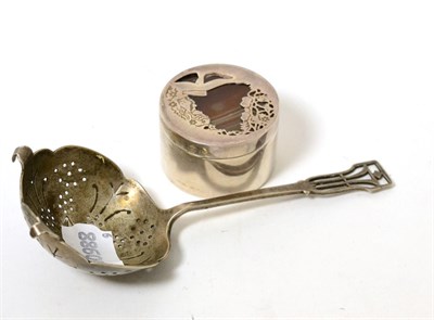 Lot 352 - A silver sifting spoon and a Scottish silver box and cover with agate mounted lid (2)