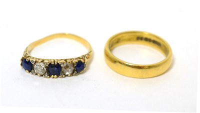 Lot 354 - An 18ct gold band ring, size M1/2 and a sapphire and diamond ring (shank misshapen) (2)