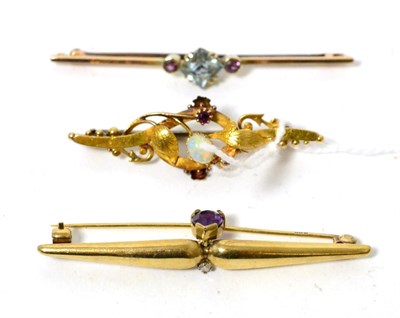 Lot 355 - A 15ct gold opal and garnet bar brooch, a 9ct gold amethyst and diamond bar brooch and an...