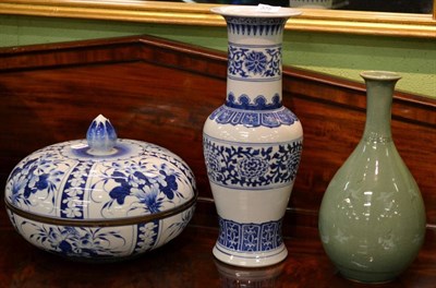 Lot 375 - A large blue and white circular box and cover, a blue and white Chinese vase and a green glazed...