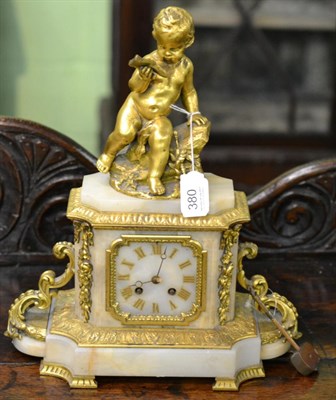 Lot 380 - An alabaster and gilt bronze striking mantel clock, surmounted by a Cherub