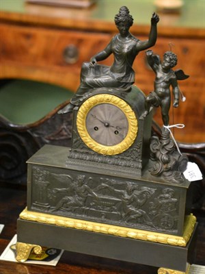 Lot 381 - A French gilt metal striking mantel clock, case depicting a lady in robes with a winged cherub