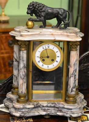 Lot 382 - A marble four glass striking mantel clock, surmounted by a lion