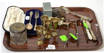 Lot 398 - A quantity of silver items consisting of two sugar tongs, caddy spoon, bangle, four silver...