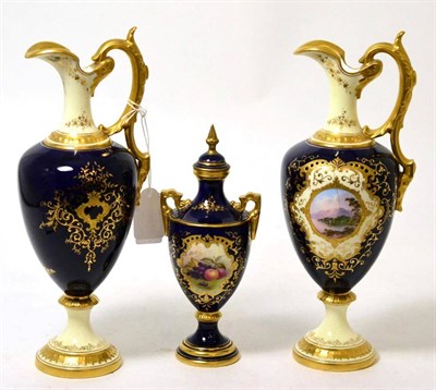 Lot 404 - A pair of Coalport ewers painted with landscapes, and a similar vase and cover painted with...