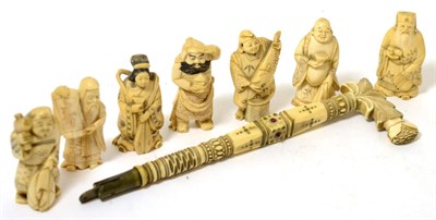 Lot 410 - Seven early 20th century carved ivory netsukes and a carved handle