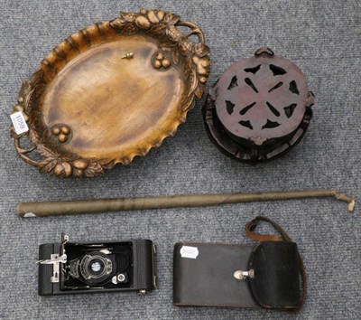 Lot 1059 - Carved fruit stand, carved hardwood stand, Kodak camera and conductors baton