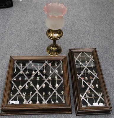 Lot 1064 - A Victorian oil lamp together with two cased sets of collectors spoons