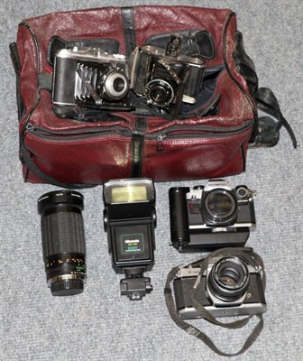 Lot 1069 - Various cameras including Olympus OMIO, one Ikonta folding, two others and two lenses