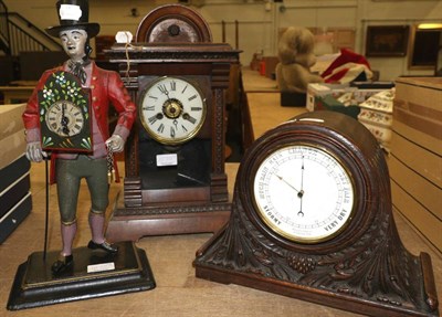 Lot 1070 - A reproduction figural mantel timepiece, a carved oak mantel aneroid barometer, a striking...