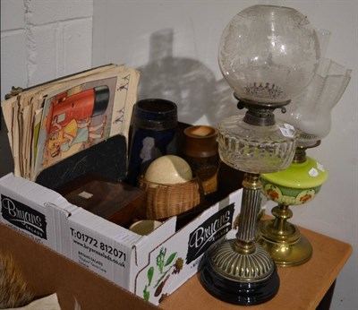 Lot 1142 - Two Victorian oil lamps, one with painted green glass reservoir the other with clear glass...