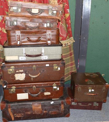 Lot 1154 - A group of nine leather, canvas and other suitcases and trunks of various size