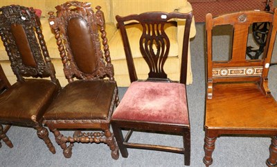 Lot 1167 - Two carved oak hall chairs together with a further two chairs (4)