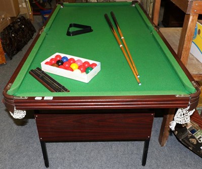 Lot 1173 - A child's folding 6ft by 3ft snooker table with two cues, balls, triangle and scoreboard